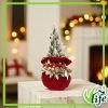 Composizione natalizia su pouf in velluto rosso con alberello innevato e decorazioni oro altezza 43 cm