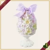 Uovo decorativo pasquale floreale su piedistallo colori assortiti, altezza 20 cm