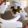 Scultura visi puzzle in cerchio in marmorina bianco e oro, altezza 29 cm