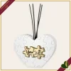 Diffusore decorativo cuore puzzle in marmorina bianco e oro, altezza 13 cm