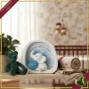Decorazione luminosa con LED elefantino con cuore celeste in marmorina bianca, altezza 12 cm